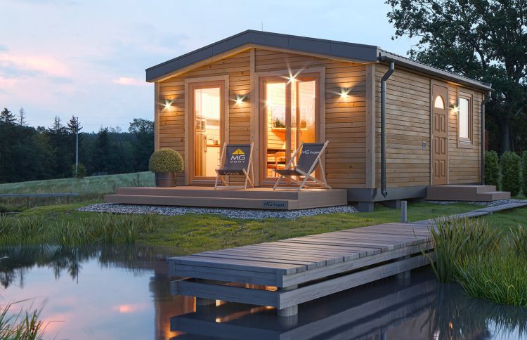 Modular home MG1 — a single-storey two-module modular house with a traditional gable roof by a lake